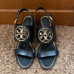 The Tori Burch city sandal in black size 8 1/2… Brand new never been worn